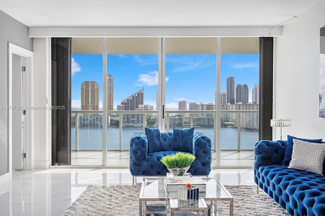 living room with a wall of windows and a water view