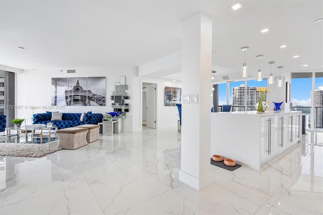 living room with floor to ceiling windows