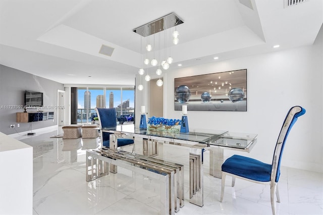 dining room featuring a tray ceiling