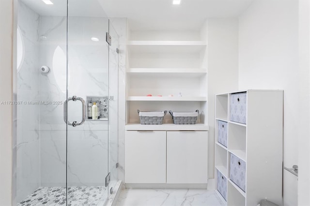 bathroom with a shower with shower door