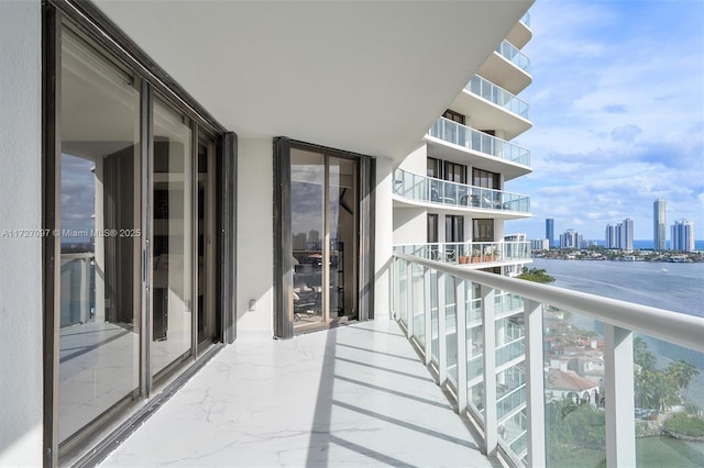 balcony featuring a water view