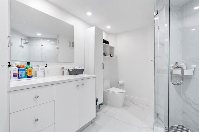 bathroom with vanity, an enclosed shower, and toilet