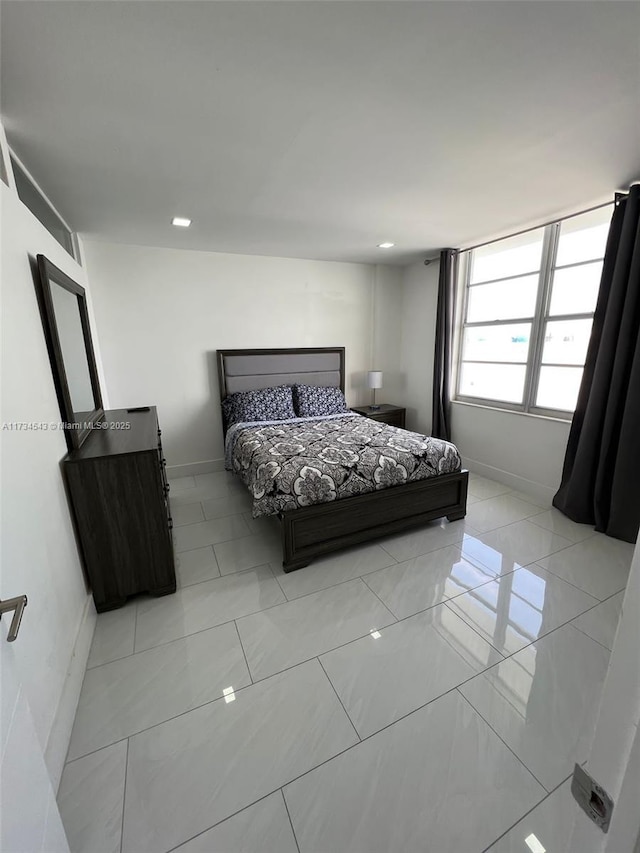 bedroom featuring light tile patterned floors