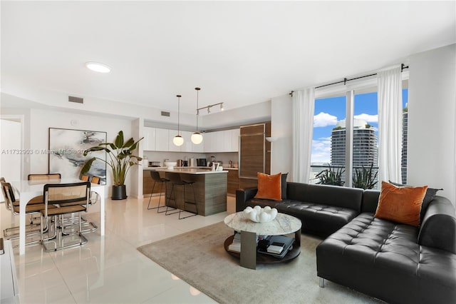 living room featuring light tile patterned flooring