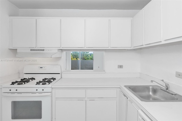 kitchen with white cabinetry, sink, and white gas range oven