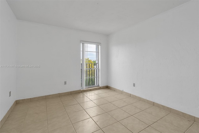 empty room with light tile patterned floors