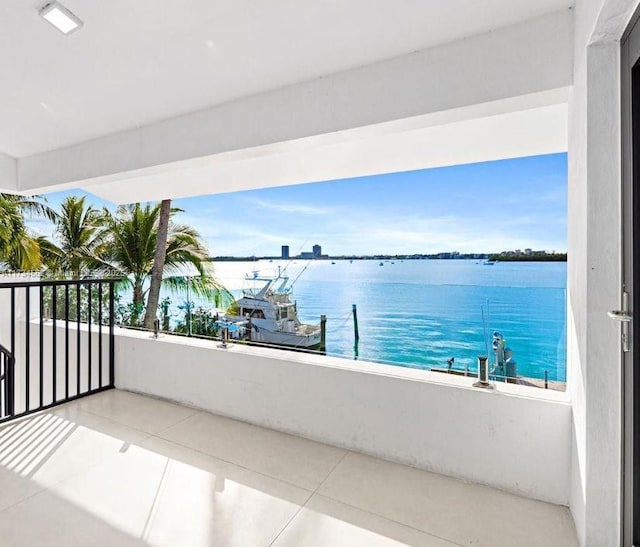 balcony featuring a water view