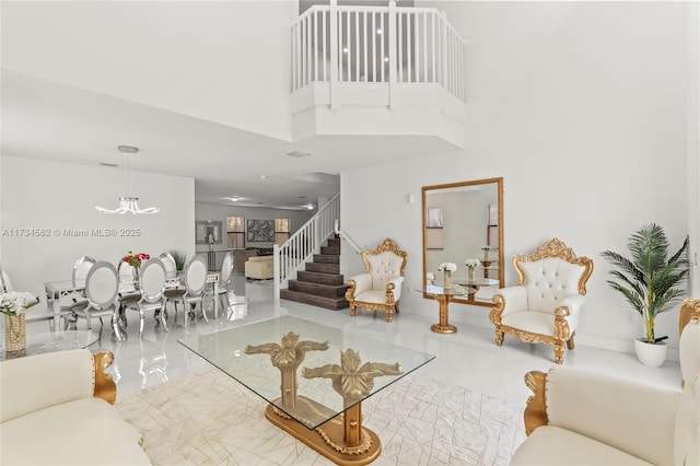 living room featuring a towering ceiling