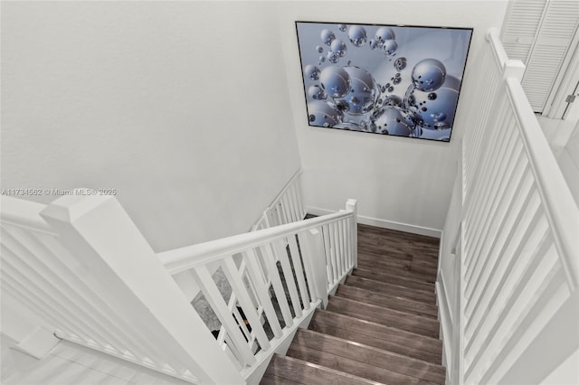 stairway featuring hardwood / wood-style floors