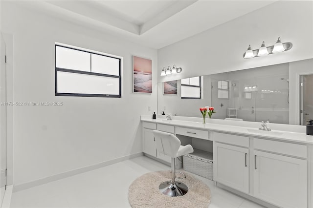 bathroom featuring an enclosed shower, vanity, tile patterned flooring, and a tray ceiling