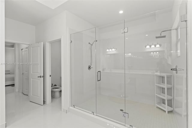 bathroom with a bidet, tile patterned floors, and a shower with shower door