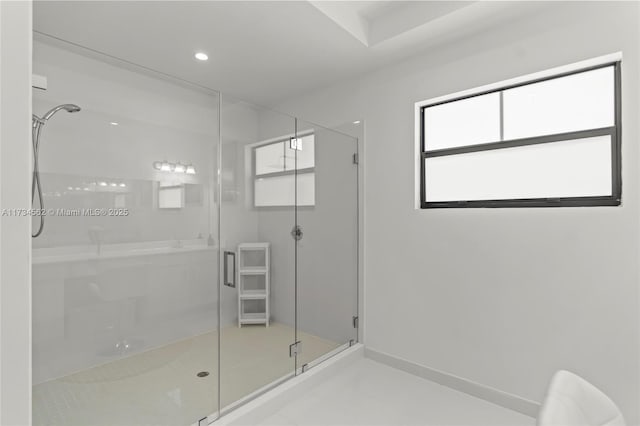 bathroom featuring tile patterned flooring and an enclosed shower