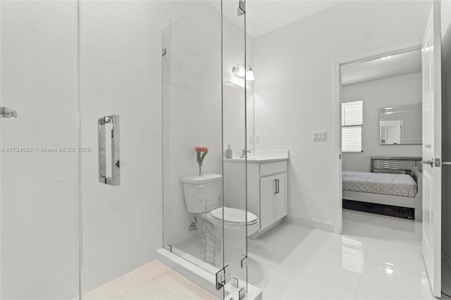 bathroom featuring tile patterned floors, vanity, toilet, and a shower with shower door