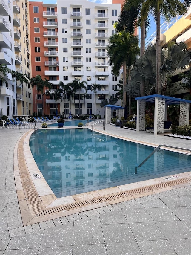 view of swimming pool with a gazebo and a patio area