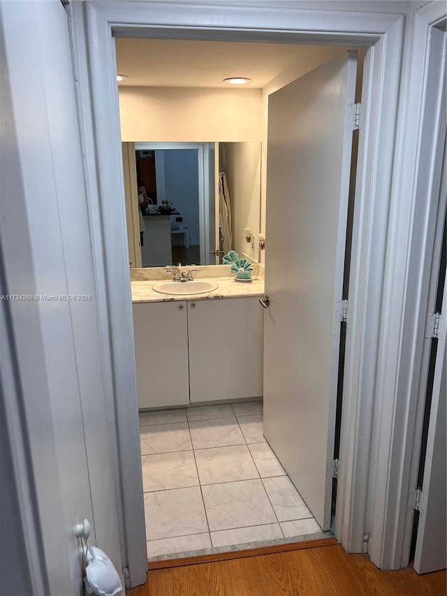 bathroom with tile patterned floors and vanity