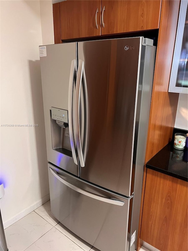 kitchen with stainless steel fridge with ice dispenser