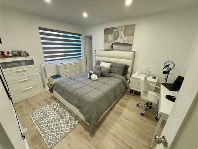 bedroom with light wood-type flooring