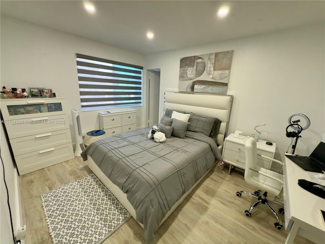 bedroom with light wood-type flooring