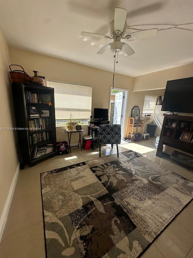 living room with light tile patterned flooring and ceiling fan