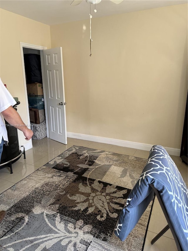 bedroom featuring tile patterned flooring and ceiling fan