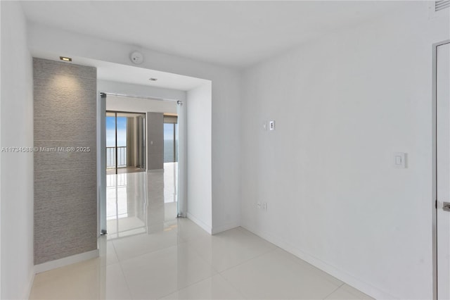 spare room with light tile patterned floors