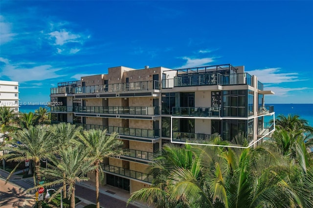 view of building exterior with a water view