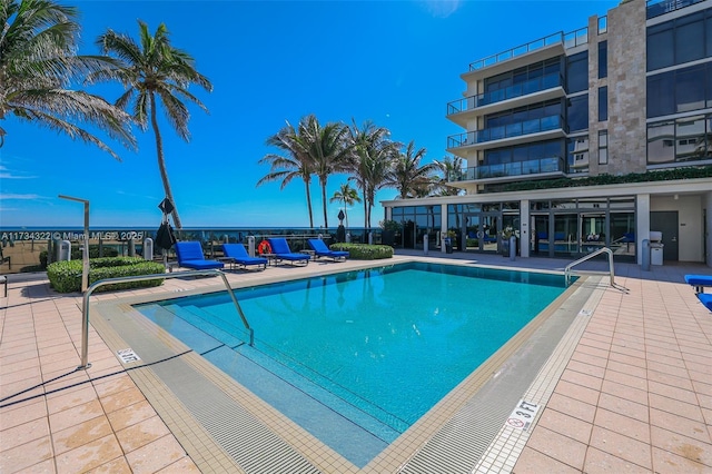 view of swimming pool with a patio