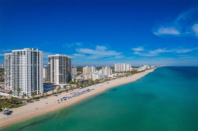 aerial view featuring a view of the beach and a water view