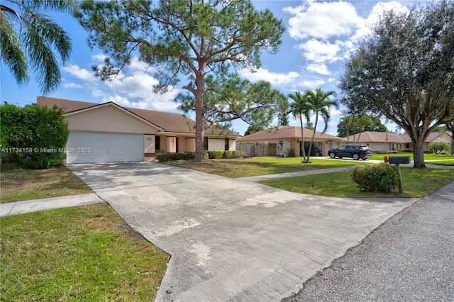 ranch-style home with a garage and a front lawn