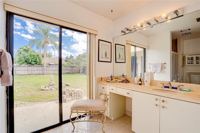 bathroom with vanity and tile patterned floors