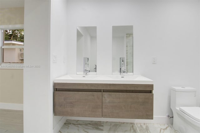 bathroom with vanity and toilet