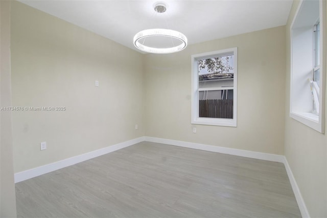 spare room featuring light wood-type flooring