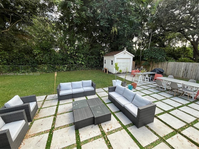 view of patio / terrace featuring outdoor lounge area and a storage unit