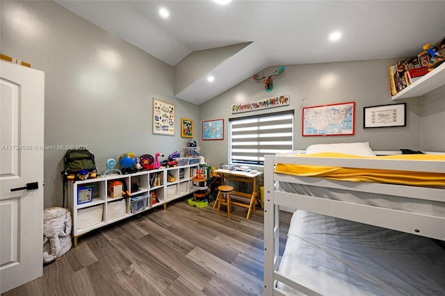 bedroom featuring lofted ceiling and hardwood / wood-style flooring