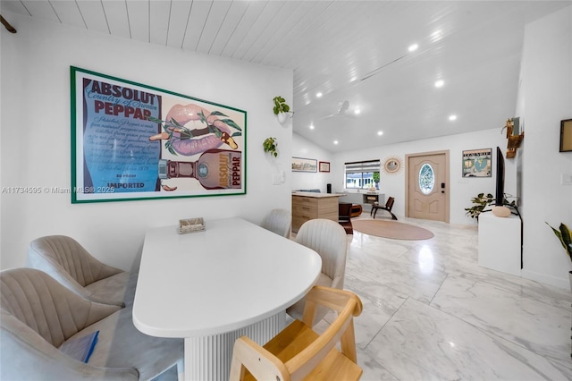 dining room featuring vaulted ceiling and wooden ceiling