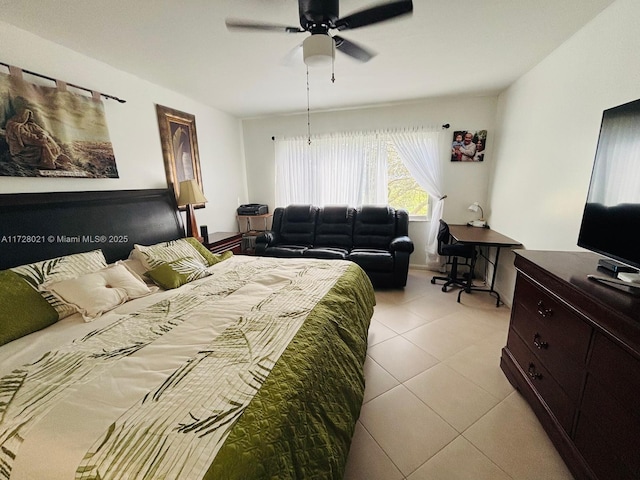 tiled bedroom featuring ceiling fan