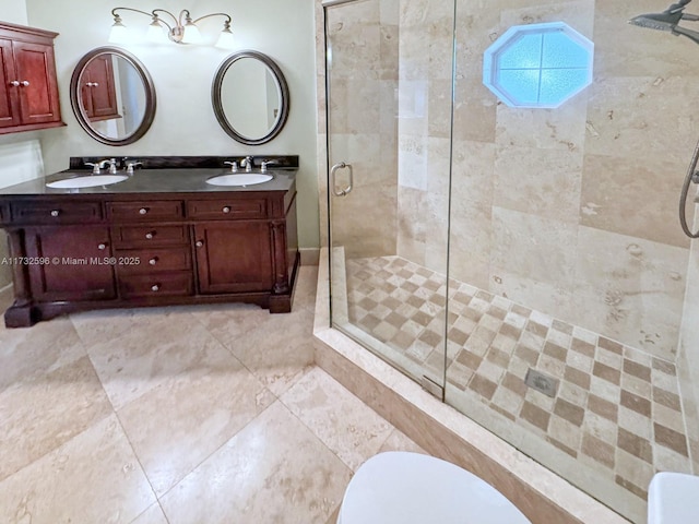 bathroom featuring vanity and a shower with shower door