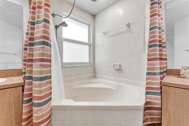 bathroom with vanity, plenty of natural light, and shower / bathtub combination with curtain