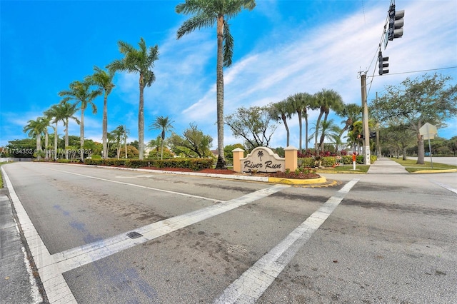 9500 Atlantic St, Miramar, FL 33025 - view of asphalt road with traffic signs, traffic lights, curbs, and sidewalks