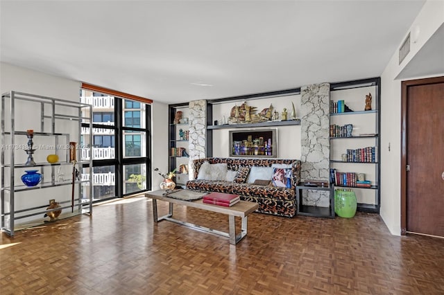 living room featuring expansive windows and parquet flooring