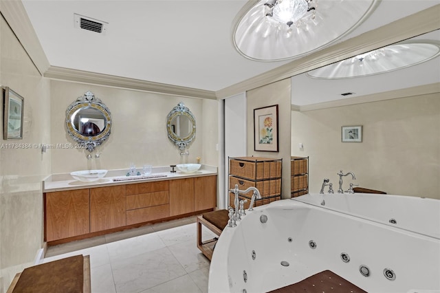 bathroom featuring ornamental molding, vanity, and a tub