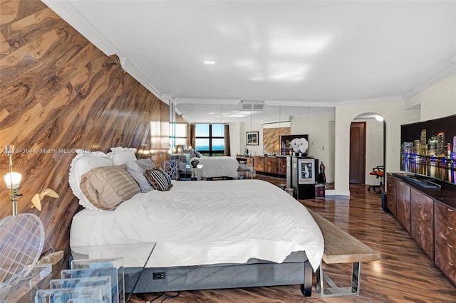 bedroom featuring ornamental molding and dark hardwood / wood-style floors