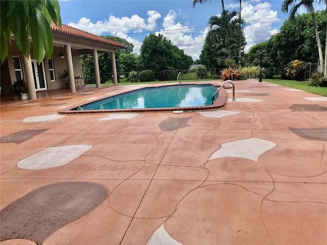 view of swimming pool featuring a patio