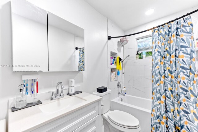 full bathroom with vanity, shower / bathtub combination with curtain, and toilet