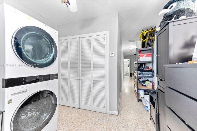 laundry area featuring stacked washer / dryer