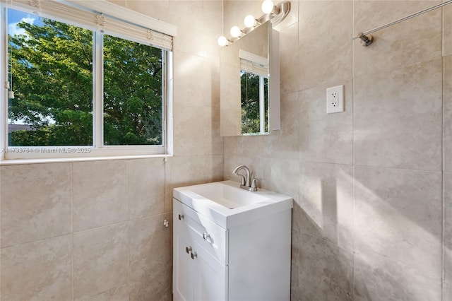 bathroom featuring vanity and a wealth of natural light