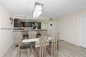 dining space with light wood-type flooring