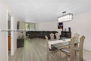 dining space featuring light wood-type flooring