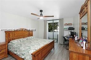 bedroom with light hardwood / wood-style floors and ceiling fan