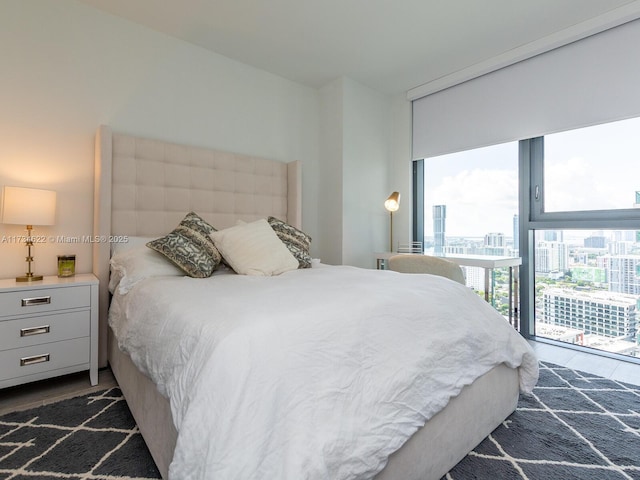 bedroom with access to exterior and floor to ceiling windows